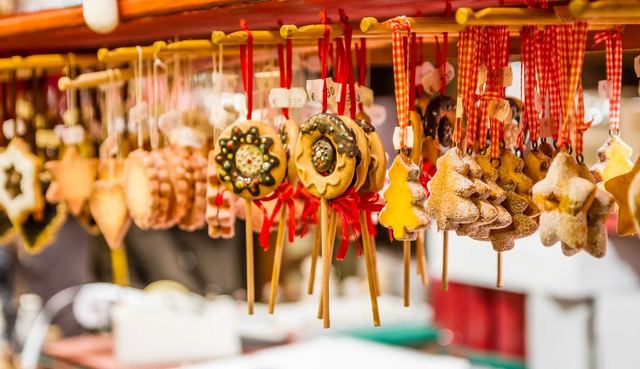 Colorful traditional gingerbread cookies hanging on display.